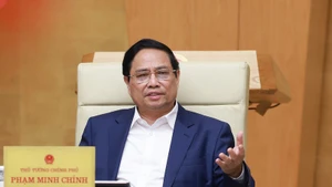 Prime Minister Pham Minh Chinh addresses the Government’s law-making session in Ha Noi on July 23. (Photo: VNA)