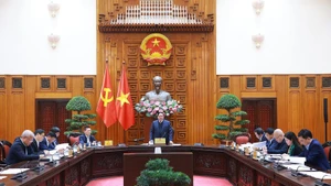 Prime Minister Pham Minh Chinh chairs the Government Steering Committee for Macroeconomic Management and Administration's second meeting. (Photo: VNA)