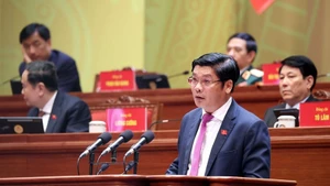 Nguyen Chi Tai, Deputy Secretary of the Hue Party Committee, delivers a presentation at the ongoing 14th National Party Congress on January 21. (Photo: VNA)
