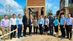 Representatives of the US Consulate General in Ho Chi Minh City, together with officials from the Viet Nam Disaster and Dyke Management Authority, visit a house constructed under the Quang Trung Campaign in Gia Lai province, December 2025.