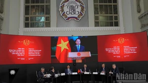 Deputy Prime Minister Tran Hong Ha delivers his remarks to the forum via a recorded message. (Photo: NDO)