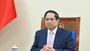 Vietnamese Prime Minister Pham Minh Chinh holds phone talks with his Malaysian counterpart Anwar Ibrahim on July 30. (Photo: VNA)