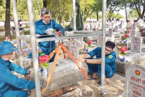 Personnel collect DNA samples from martyrs’ remains at the Road 9 National Martyrs' Cemetery.