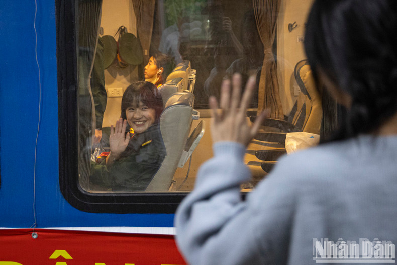 Relatives said goodbye to the soldiers through the train window.