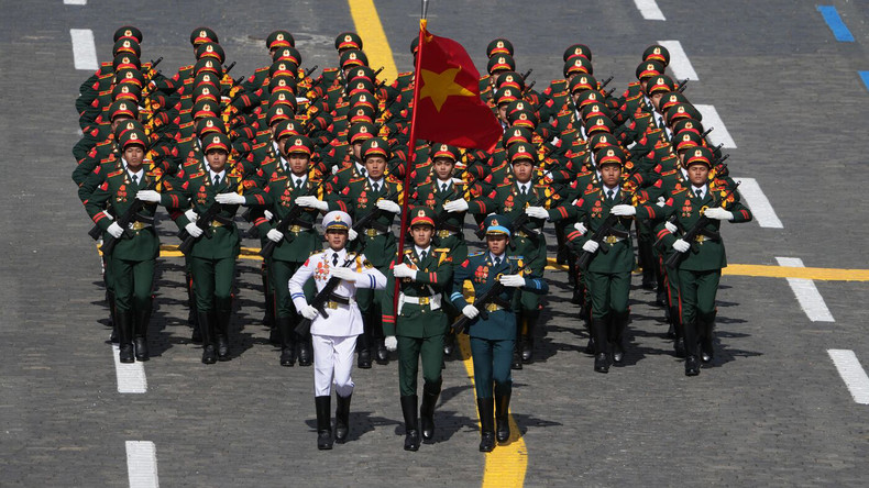 Troops of the Viet Nam People's Army march past the grandstand during the Victory Day parade.