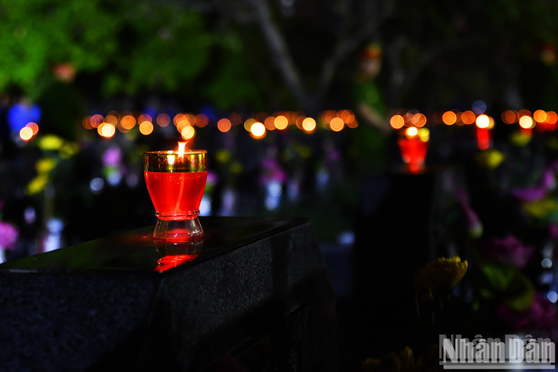 Thousands of candles illuminate the night.