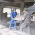 Workers load and unload cement. (Photo: VNA)