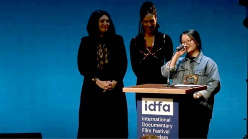 Ha Le Diem speaking at the International Documentary Film Festival in Amsterdam.