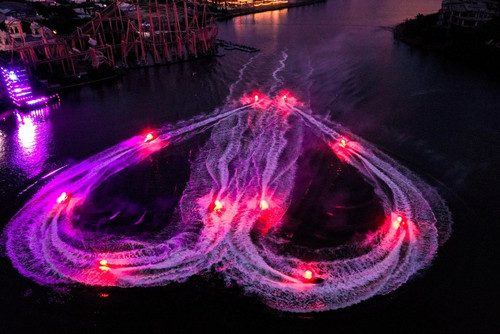 A romantic water display by Jetski athletes in the Awaken River show