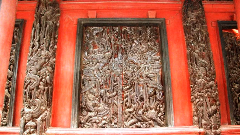 The doors of the front hall of Xam Temple are intricately carved.