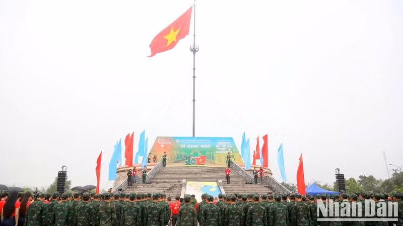 The red flag with a yellow star flying on the Hien Luong Flag Tower.