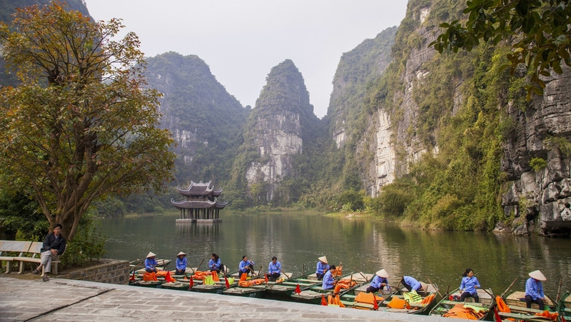Ninh Binh, locally known as ‘Halong Bay on Land,’ also attracts tourists with its magical riverine landscape and sheer limestone mountains rising from the paddies. 