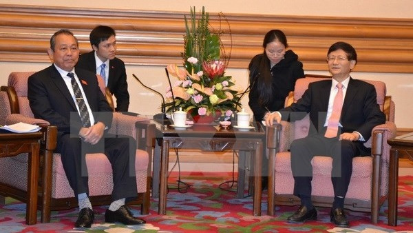 Chief Justice of the Vietnam Supreme People’s Court Truong Hoa Binh meets with Secretary of the Chinese Party Committee's Commission for Political and Legal Affairs Meng Jianzhu. (Credit: VNA)