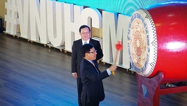Deputy PM Pham Binh Minh beats the drum to open the new academic year at the Vietnam National University – Ho Chi Minh City. (Photo: vnuhcm.edu.vn)