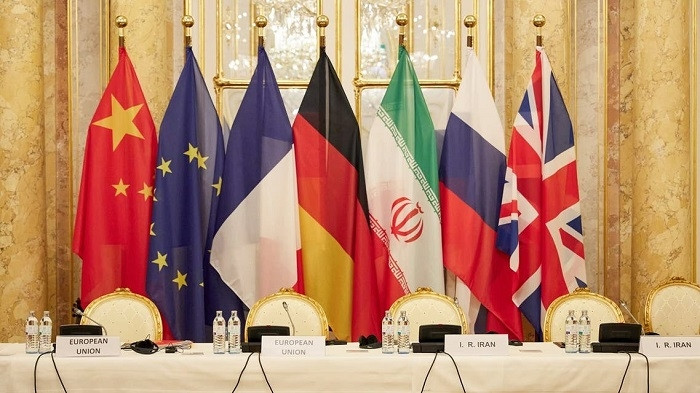 This handout photo taken and released on December 9, 2021 by the EU delegation in Vienna - EEAS shows flags of participating states during a meeting of the joint commission on negotiations aimed at reviving the Iran nuclear deal in Vienna, Austria. (Photo: AFP)
