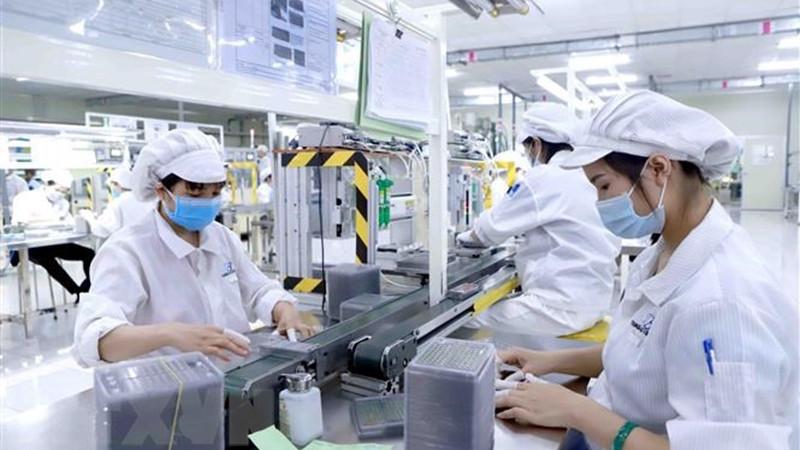 Manufacturing of electronic parts. (Photo: VNA)