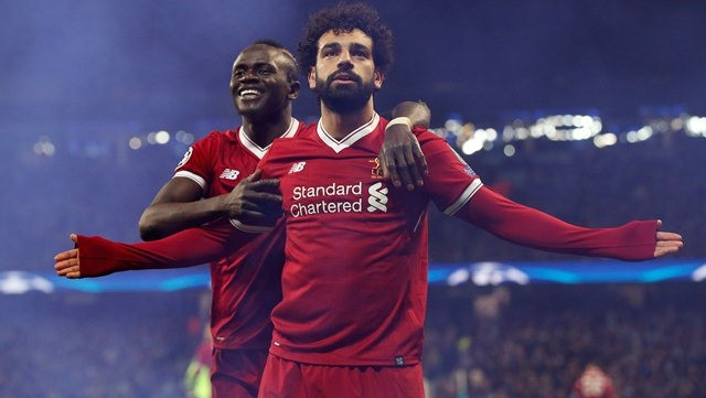Liverpool's Mohamed Salah celebrates scoring their first goal with Sadio Mane during the Champions League quarter-final second leg against Manchester City at Etihad Stadium, Manchester, the UK, April 10. (Photo: Reuters)