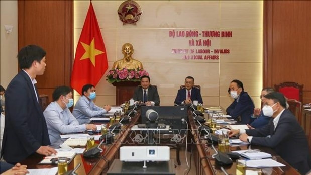 At the working session. (Photo: VNA)