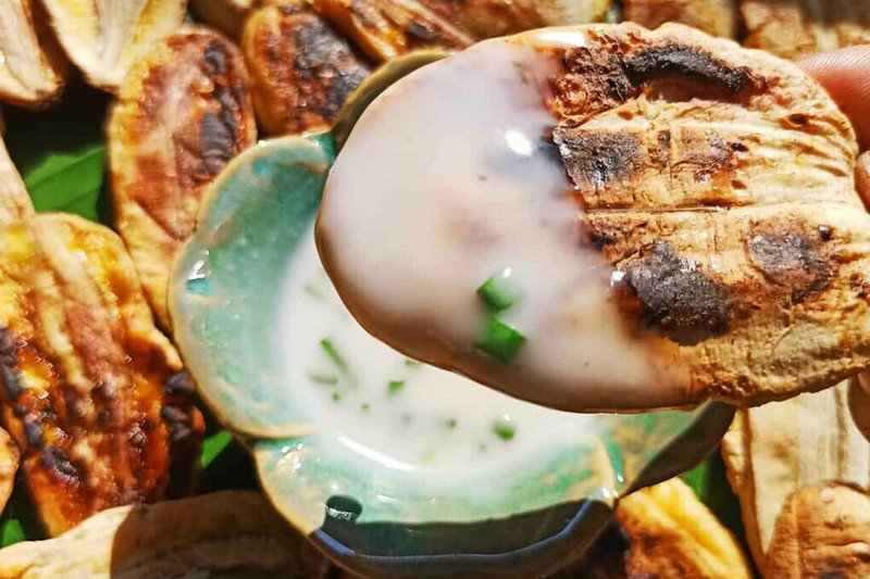 Grilled banana with coconut dip.