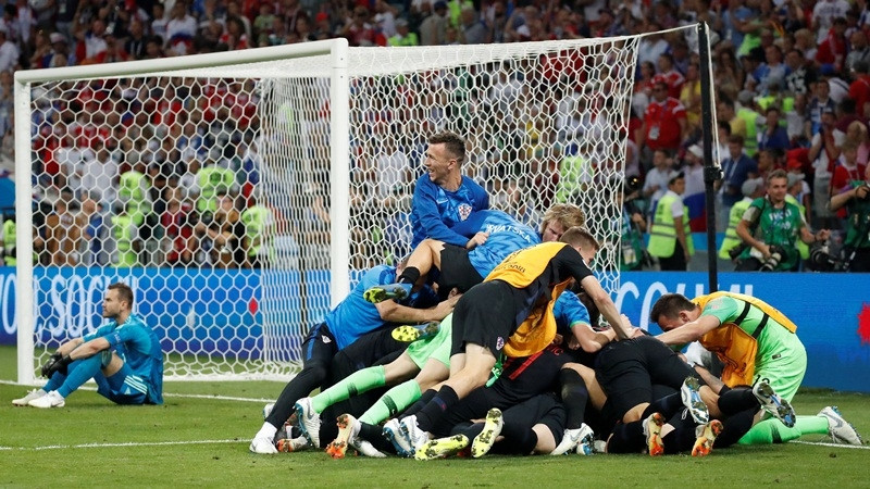 Russian goalkeeper Igor Akinfeev looked dejected while the Croatian players celebrated a dramatic victory following the penalty shootout during their quarter-final match at Fisht Olympic Stadium, Sochi. (Photo: Reuters)