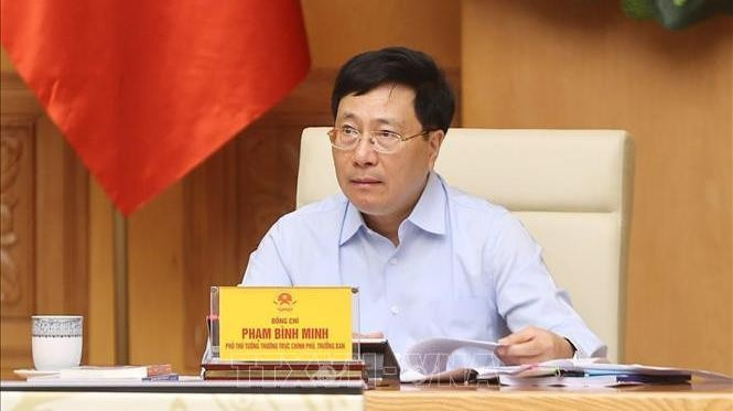 Deputy Prime Minister Pham Binh Minh speaking at the meeting (Photo: VNA)