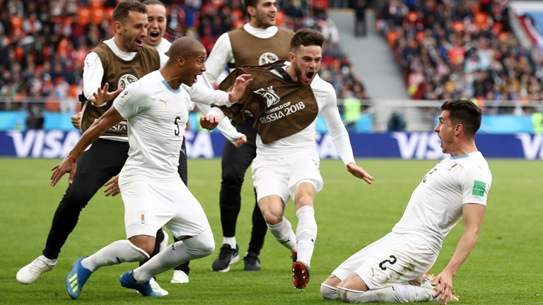 Uruguayan players celebrates Gimenez's goal. (Photo: FIFA)