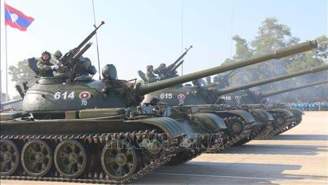 A parade was held along with aircraft and parachute performances at the meeting (Photo: VNA)