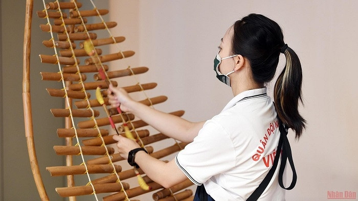 Tuning the bamboo xylophone.