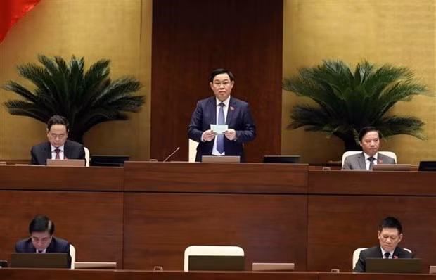 NA Chairman Vuong Dinh Hue speaks after the Finance Minister finishes replying to legislators' questions on June 8. (Photo: VNA)