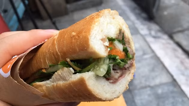 Banh mi contains a more colourful combination of cheese, cold cuts, pickled vegetables, sausage, fried egg, fresh coriander and chilli sauce.