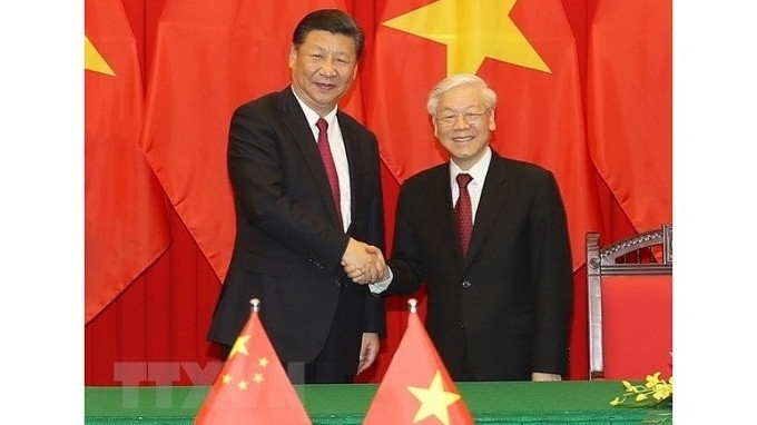 Party General Secretary and President Nguyen Phu Trong (right) and his Chinese counterpart Xi Jinping. (Photo: VNA)