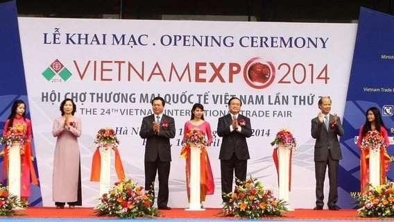 Deputy Prime Minister Hoang Trung Hai attends the opening ceremony of 2014 Vietnam Expo (Source: VNA)
