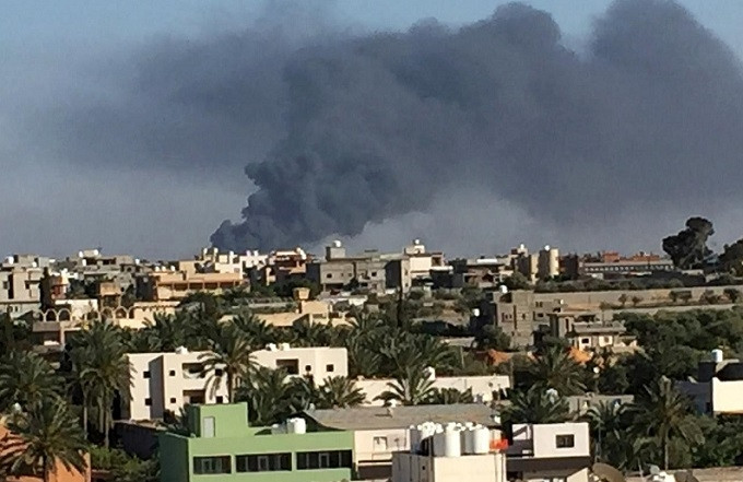 Smoke rises during a fight between members of the Libyan internationally recognised government forces and Eastern forces in Ain Zara, Tripoli, Libya May 5, 2019. (Photo: Reuters)
