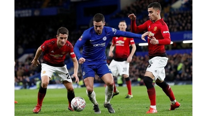 Chelsea's Eden Hazard in action with Manchester United's Andreas Pereira and Ander Herrera. (Photo: Reuters)