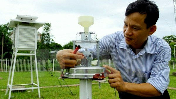 A meteorologist checks weather forecasting equipment. (Image credit: VNA)