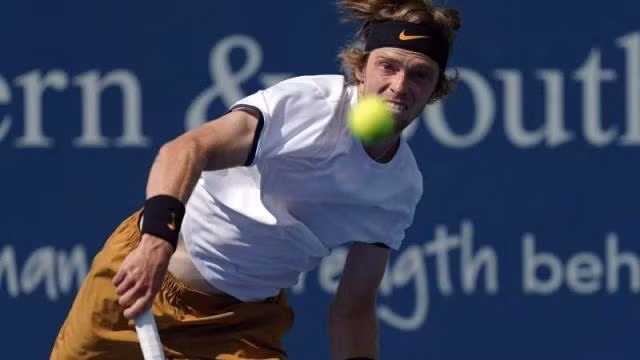 Aug 15, 2019; Mason, OH, USA; Andrey Rublev (RUS) serves against Roger Federer (SUI) during the Western and Southern Open tennis tournament at Lindner Family Tennis Center. Mandatory Credit: Aaron Doster-USA TODAY Sports