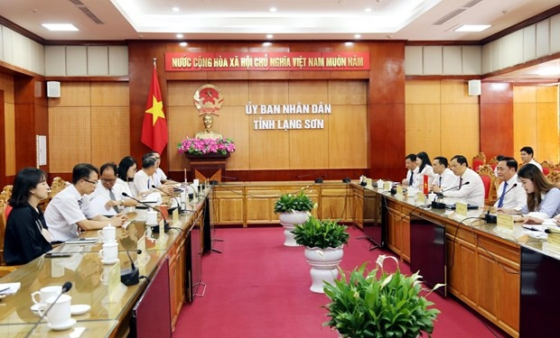At the working session (Photo: VNA)