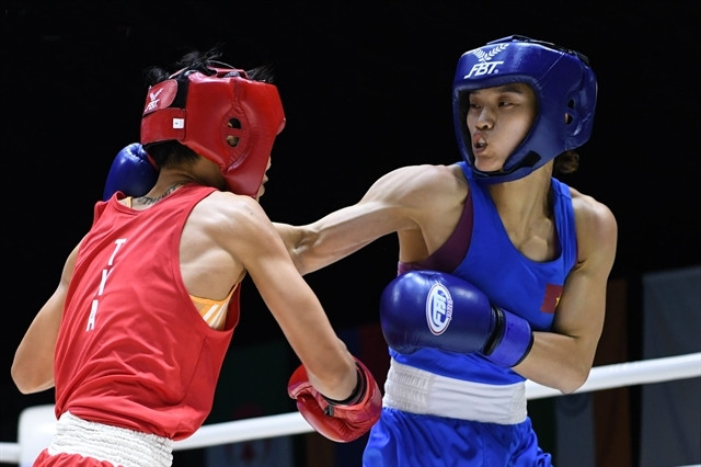 Nguyen Thi Tam (right) wins Vietnam’s first gold medal, in the women’s 51kg class, at the Thailand Open International Boxing Tournament. (Photo: Asian Boxing Confederation)