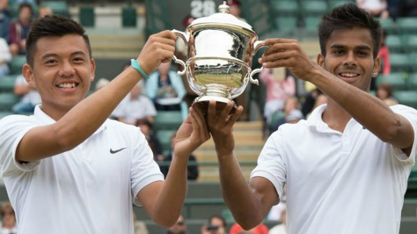Ly Hoang Nam (left) and his Indian partner Sumit Nagal win the Wimbledon boys’ doubles title.