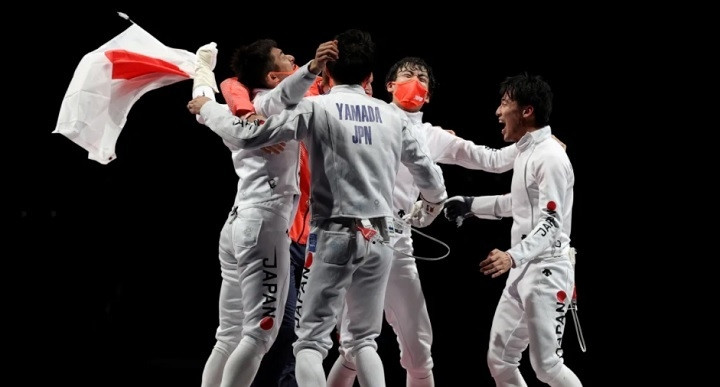 Japanese fencers celebrate winning the country’s first-ever Olympic gold in the men’s epee team event. (Photo: Getty Images)