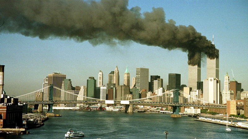 The towers of the World Trade Center pour smoke shortly after being struck by hijacked commercial airplanes in New York on September 11, 2001. (Photo: Reuters) 