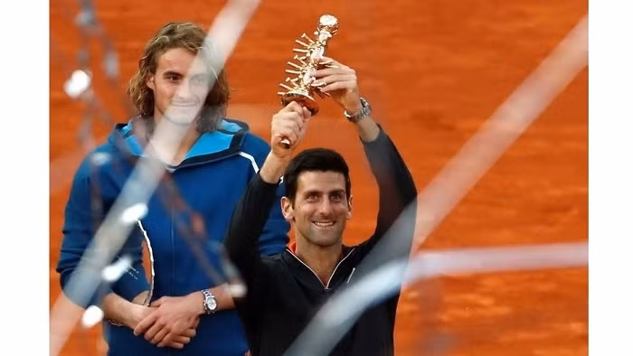 Serbia's Novak Djokovic and Greece's Stefanos Tsitsipas pose with their trophies after Novak Djokovic wins the final - ATP 1000 - Madrid Open - The Caja Magica, Madrid, Spain - May 12, 2019. (Photo: Reuters)
