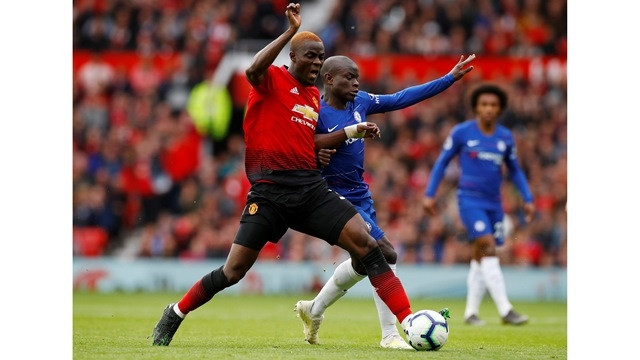 FILE PHOTO: Soccer Football - Premier League - Manchester United v Chelsea - Old Trafford, Manchester, Britain - April 28, 2019 Chelsea's N'Golo Kante in action with Manchester United's Eric Bailly.