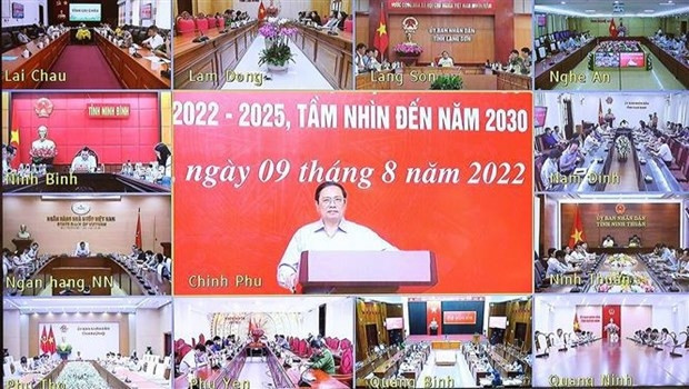 Prime Minister Pham Minh Chinh (centre) speaks at the event. (Photo: VNA)