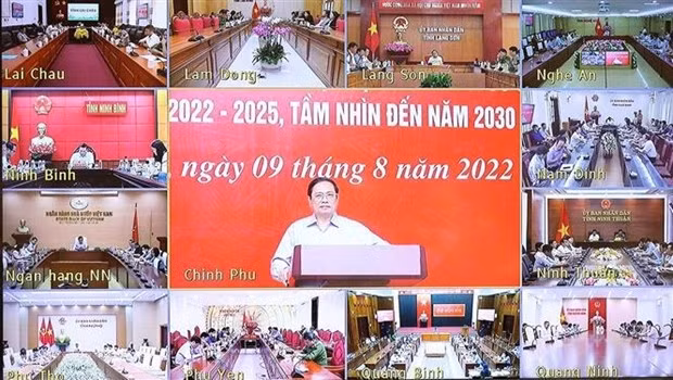 Prime Minister Pham Minh Chinh (centre) speaks at the event. (Photo: VNA)