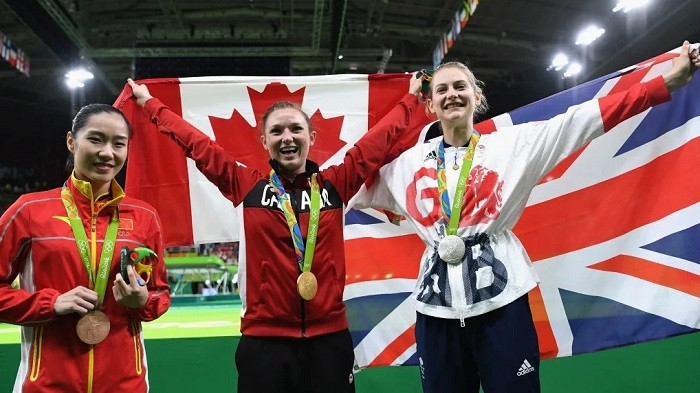 Bronze medallist Dan Li of China, gold medallist Rosie Maclennan of Canada and silver medalist Bryony Page of Great Britain pose after the medal ceremony for the Trampoline Gymnastics Women's Final at the Rio 2016 Olympic Games on August 12, 2016 in Rio de Janeiro, Brazil. (Photo: Getty Images)