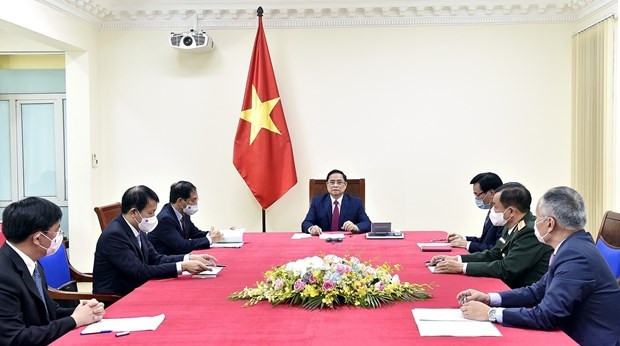 Prime Minister Pham Minh Chinh in the online talks with Chinese Premier Li Keqiang (Photo: VNA)
