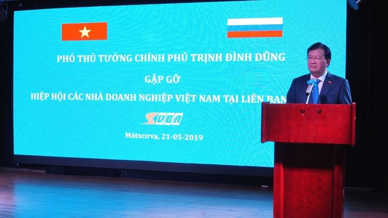 Deputy PM Trinh Dinh Dung speaking at the event (Photo: VNA)