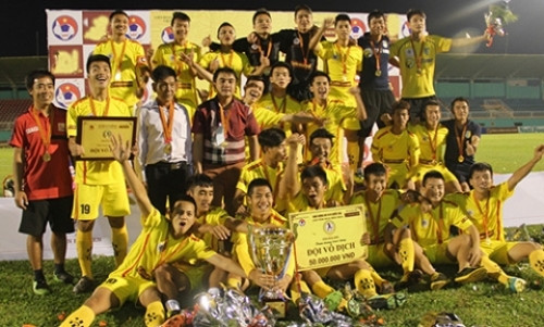 Hanoi T&T players cheer after winning the National U19 Football Championships.