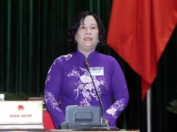 The Minister of Labour, War Invalids and Social Affairs Pham Thi Hai Chuyen answering NA deputies’ questions (Photo: VNA)